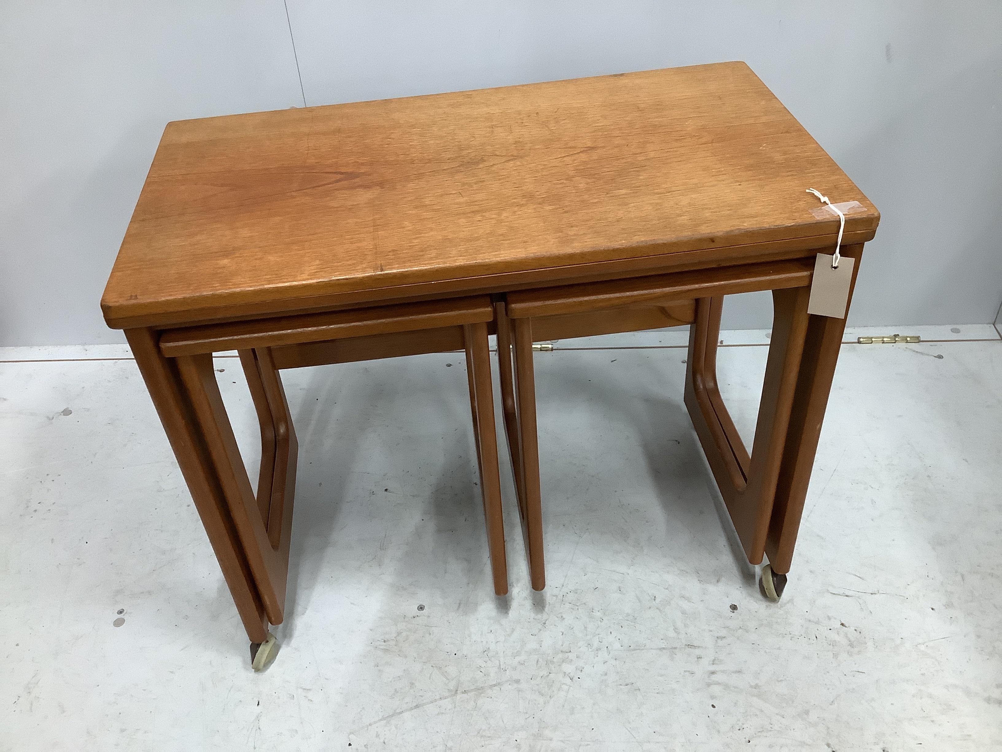 A McIntosh mid century teak triform nest of tables, width 74cm, depth 40cm, height 61cm